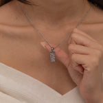 Silver The Moon tarot necklace with cubic zirconia accents and an mother of pearls back stone, symbolizing intuition, mystery and subconscious. 