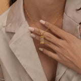 Gold the wheel tarot necklace with cubic zirconia accents and a mother of pearl back stone, symbolizing change, destiny, and the cycles of life. 
