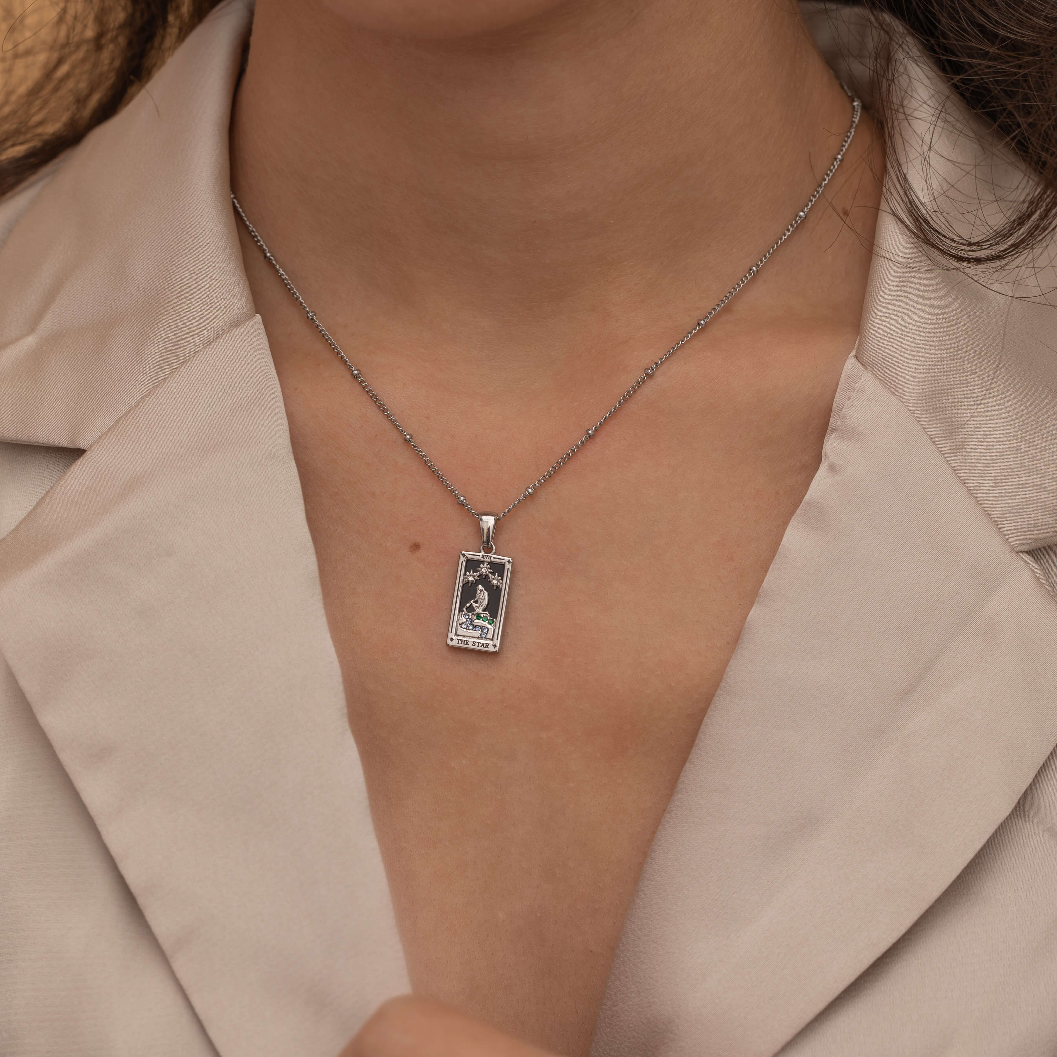 Silver the star tarot necklace with cubic zirconia accents and an onyx  back stone, symbolizing hope, inspiration, and spiritual guidance 