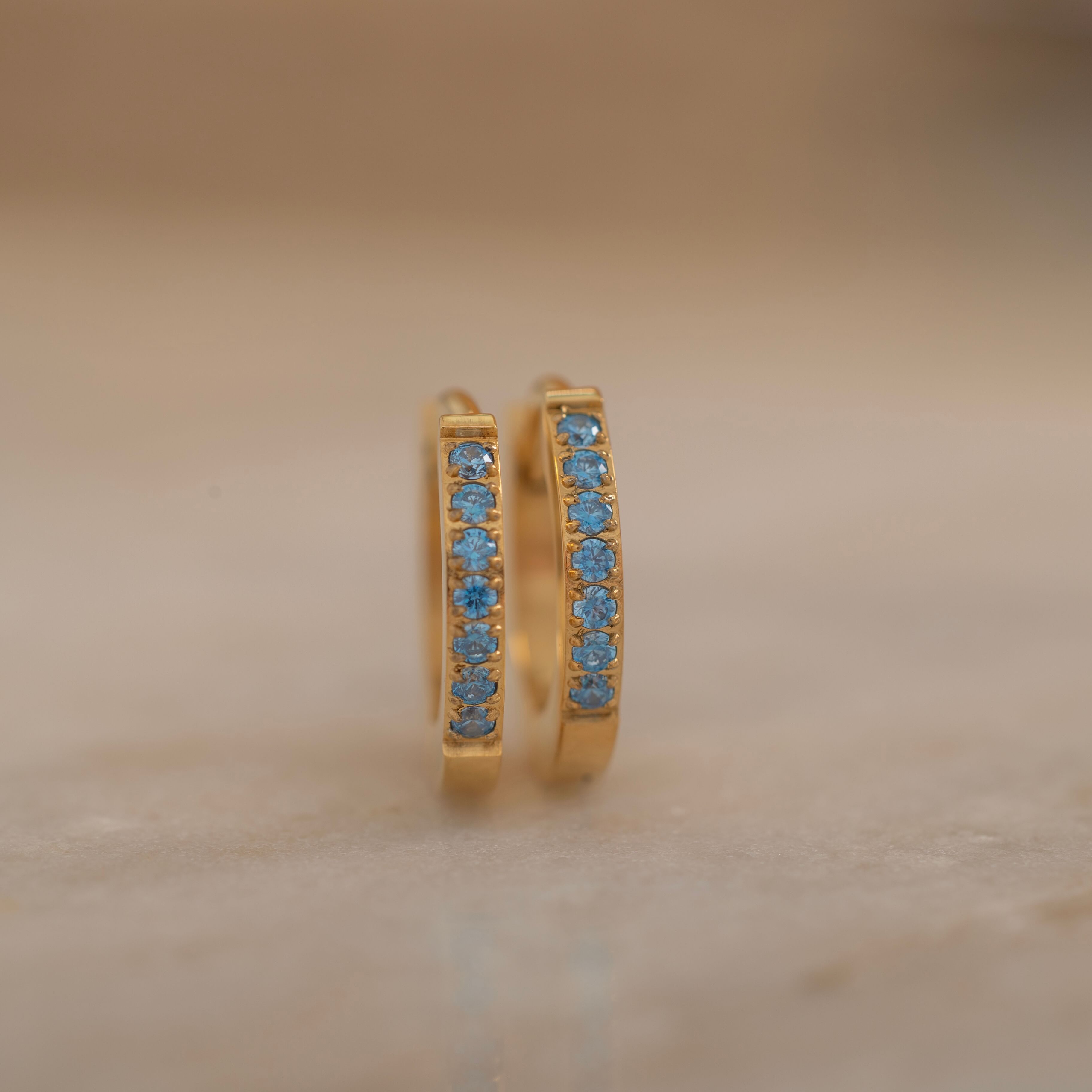 Matching pair blue huggie hoops earrings, gold birthstone earrings