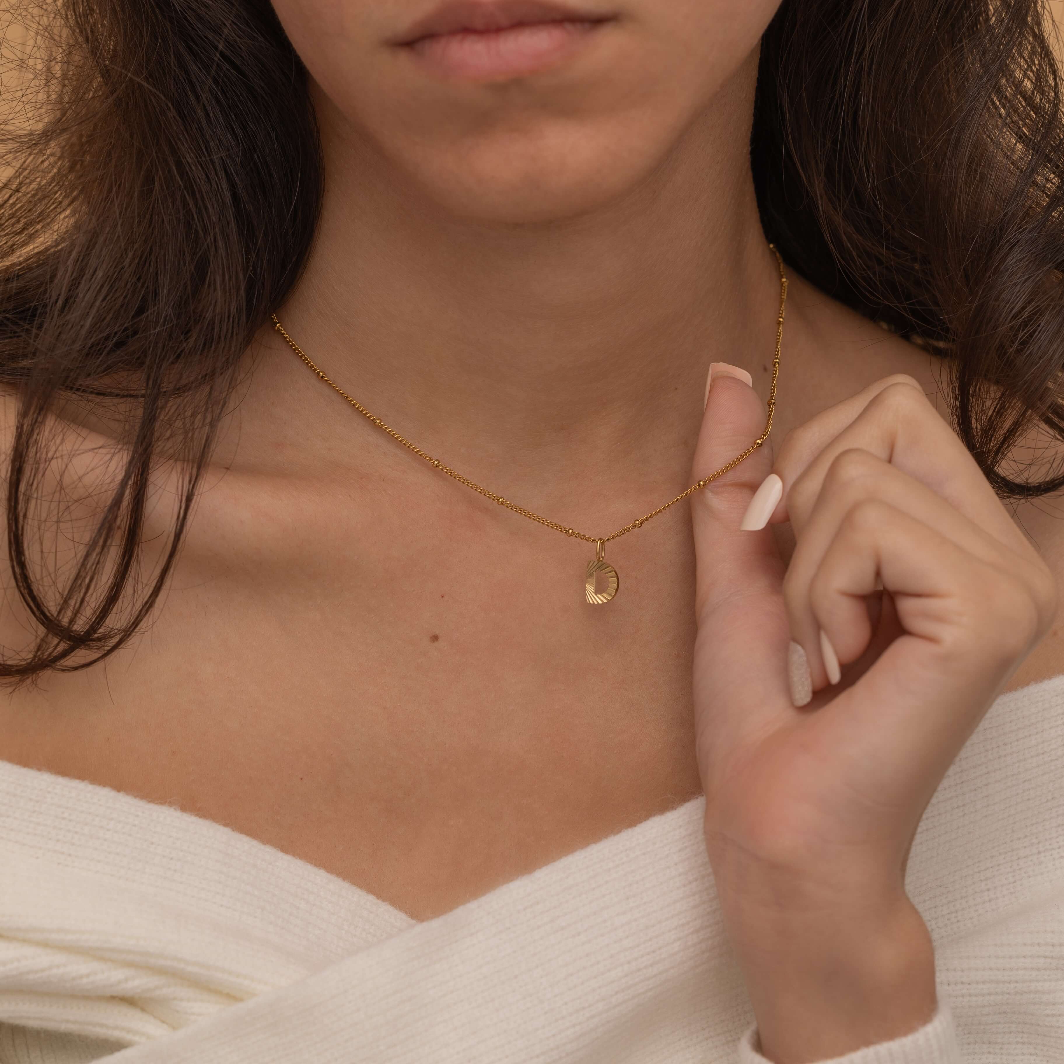 Gold Custom Sunburst Initial Necklace with custom chain styles. Perfect for everyday wear, waterproof and tarnish free