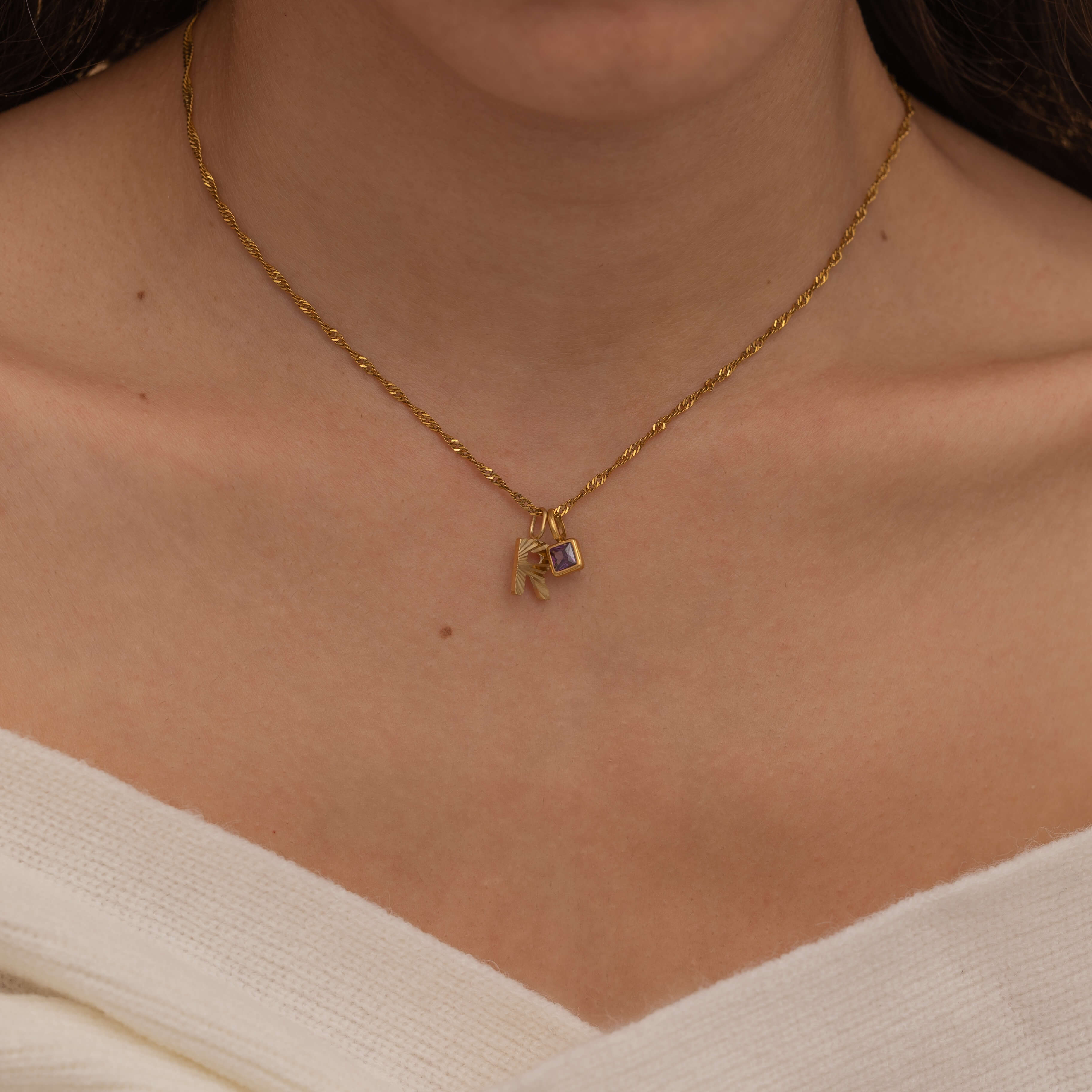 Gold Custom Sunburst Initial Necklace with custom birthstones. Perfect for everyday wear, waterproof and tarnish free