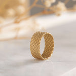 Elegant gold band with a unique woven design