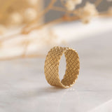 Elegant gold band with a unique woven design