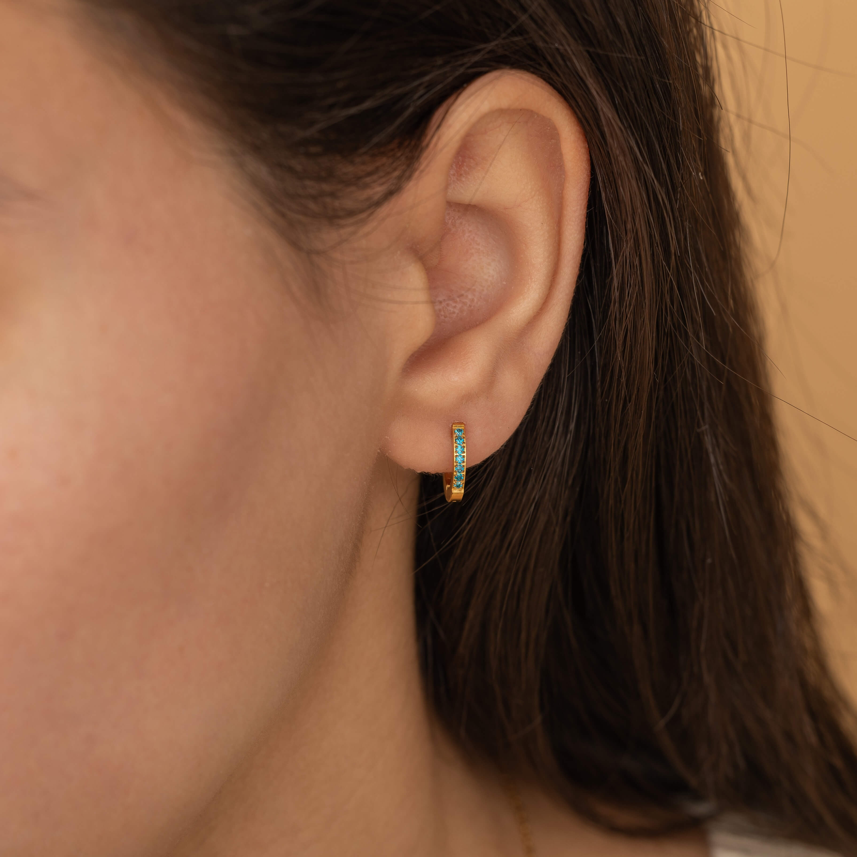 gold march birthstone blue huggie hoop earrings 