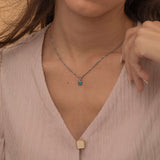 Square birthstone charms in gold and silver frames on a necklace, with multiple colorful birthstone charms representing different birth months