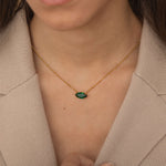 large marquise emerald green stone necklace with satellite chain.