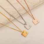 silver, gold, and rose gold initial necklace with multiple of chain styles