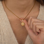 gold evil eye sunburst in a box chain necklace