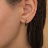 pave emerald gemstone huggie hoop earrings in gold