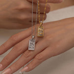 Silver and Gold The Moon tarot necklace with cubic zirconia accents and an mother of pearls back stone, symbolizing intuition, mystery and subconscious. 