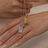 Silver and Gold The Moon tarot necklace with cubic zirconia accents and an mother of pearls back stone, symbolizing intuition, mystery and subconscious. 