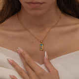 Gold the empress tarot necklace with cubic zirconia accents and an turquoise back stone, symbolizing abundance, beauty, and feminine power. 