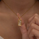 Gold The Moon tarot necklace with cubic zirconia accents and an mother of pearls back stone, symbolizing intuition, mystery and subconscious. 