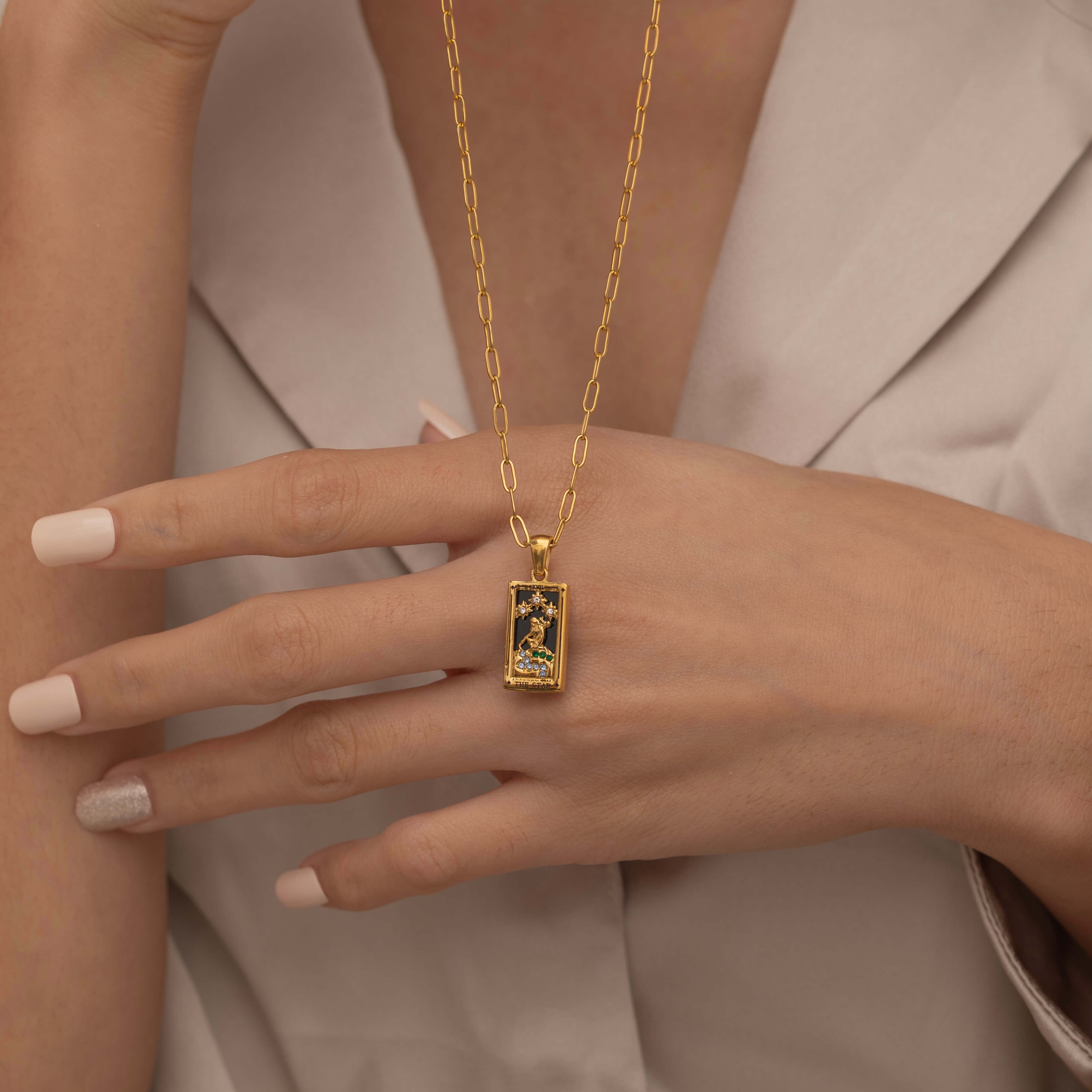  Gold the star tarot necklace with cubic zirconia accents and an onyx  back stone, symbolizing hope, inspiration, and spiritual guidance 