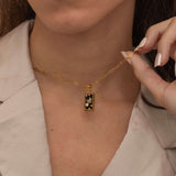  Gold the world tarot necklace with cubic zirconia accents and an black onyx back stone, symbolizing completion, unity, and the cyclical nature of life