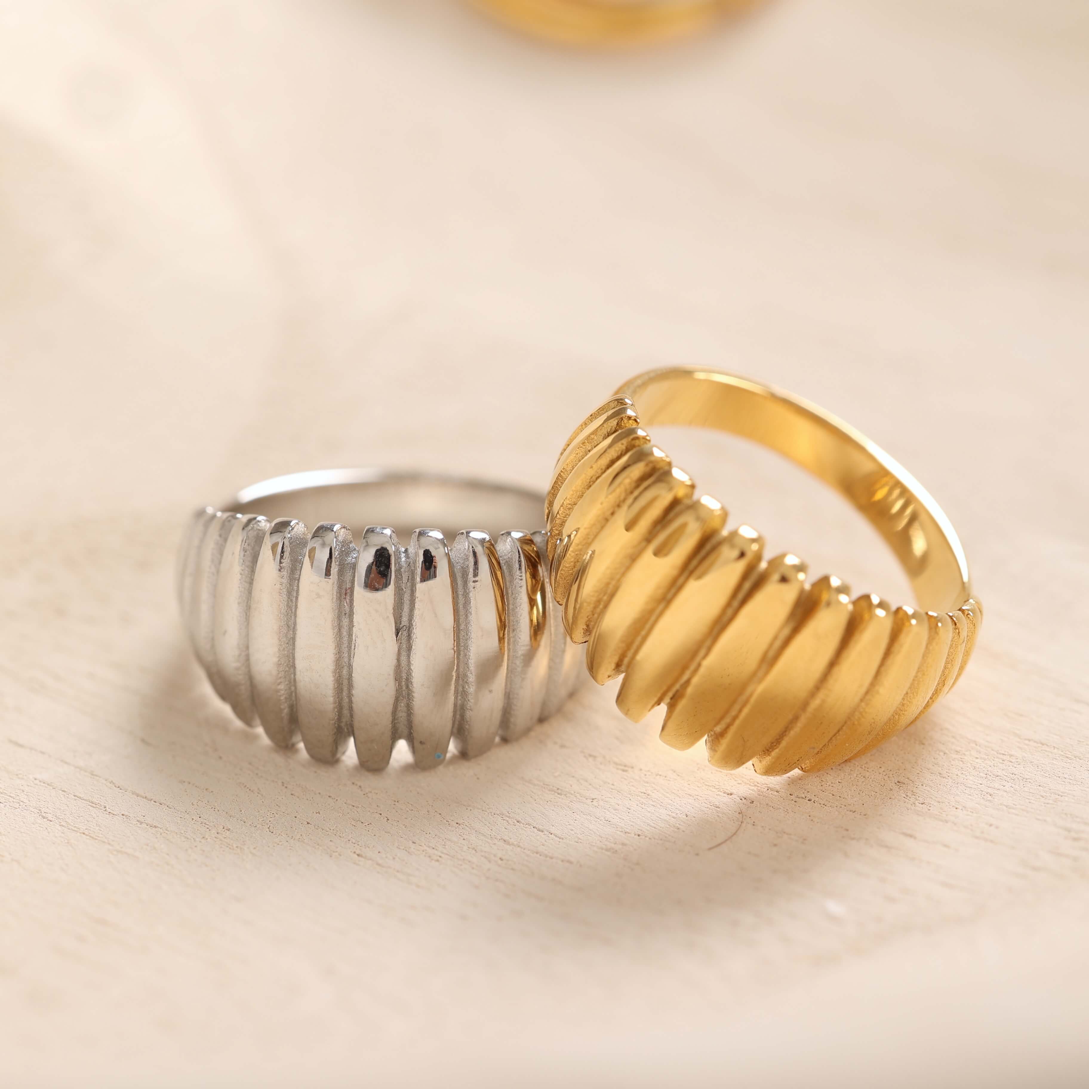 Gold and silver ribbed design rings from our jewelry collection, perfect for adding a stylish touch to any outfit