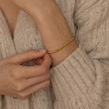 Tarnish-free and waterproof gold beaded bracelet with polished beads, perfect for adding a touch of elegance to any outfit