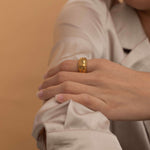 Gold checkered ring with textured design, stylish and modern statement jewelry piece