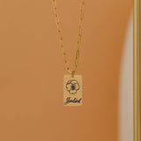 Gold necklace with engraved birth flower and name pendant, featuring a customizable birth month jewelry.