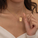 Gold necklace with engraved birth flower and custom initial pendant, perfect for personalized keepsake jewelry