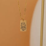 Gold zodiac pendant necklace with engraved zodiac symbol