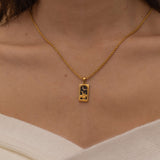 Gold the knight of cups tarot necklace with cubic zirconia accents and a black onyx back stone, symbolizing emotional depth, intuition, and the pursuit of dreams