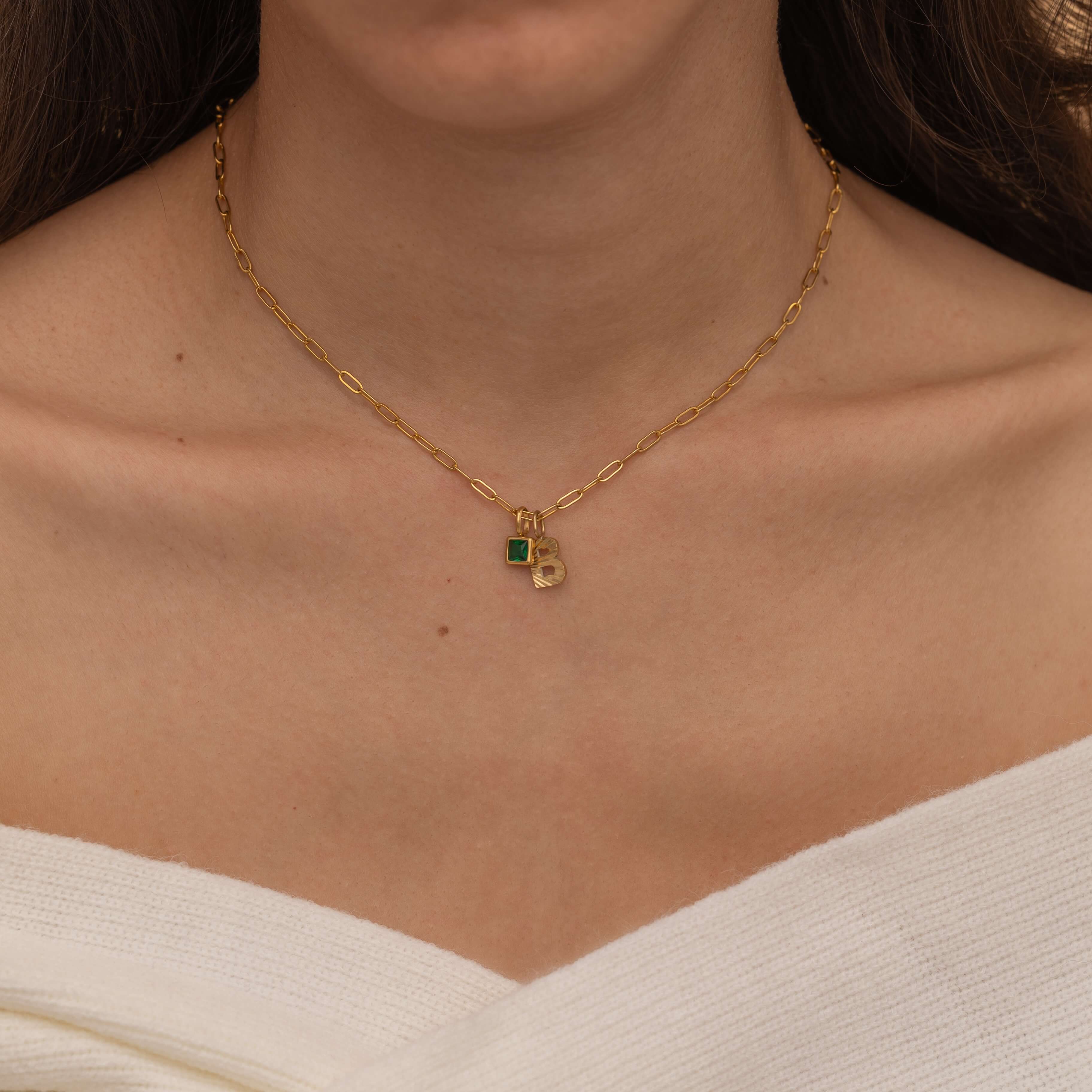 Gold Custom Sunburst Initial Necklace with custom birthstones. Perfect for everyday wear, waterproof and tarnish free