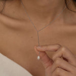 Silver lariat necklace with a freshwater pearl drop, shaped in a y necklace with  minimalist and elegant look.