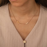 Rose Gold necklace with multiple engraved name bar charms, personalized family name jewelry