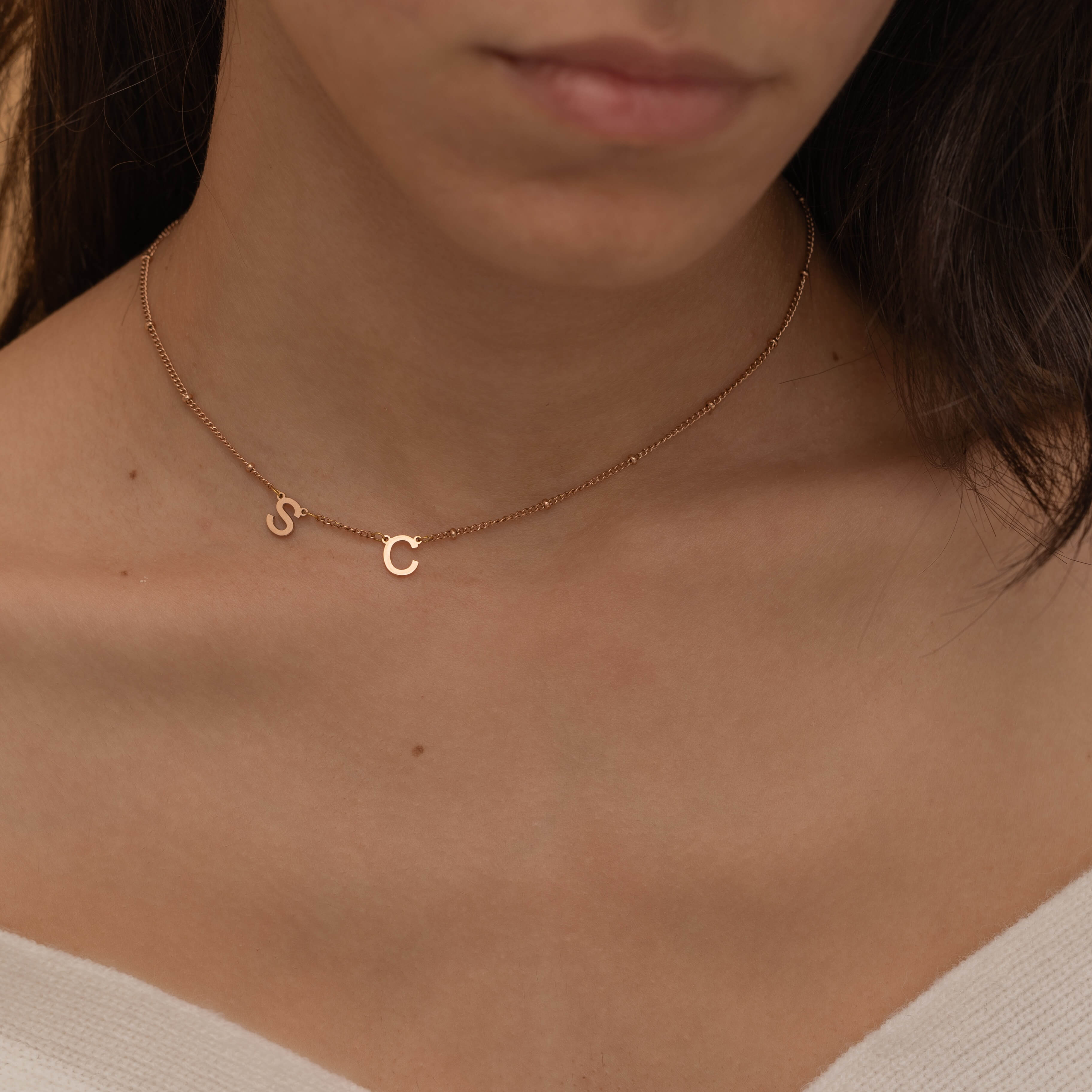 Rose Gold Custom side initial necklace with custom chain styles. It is waterproof and tarnish free. 