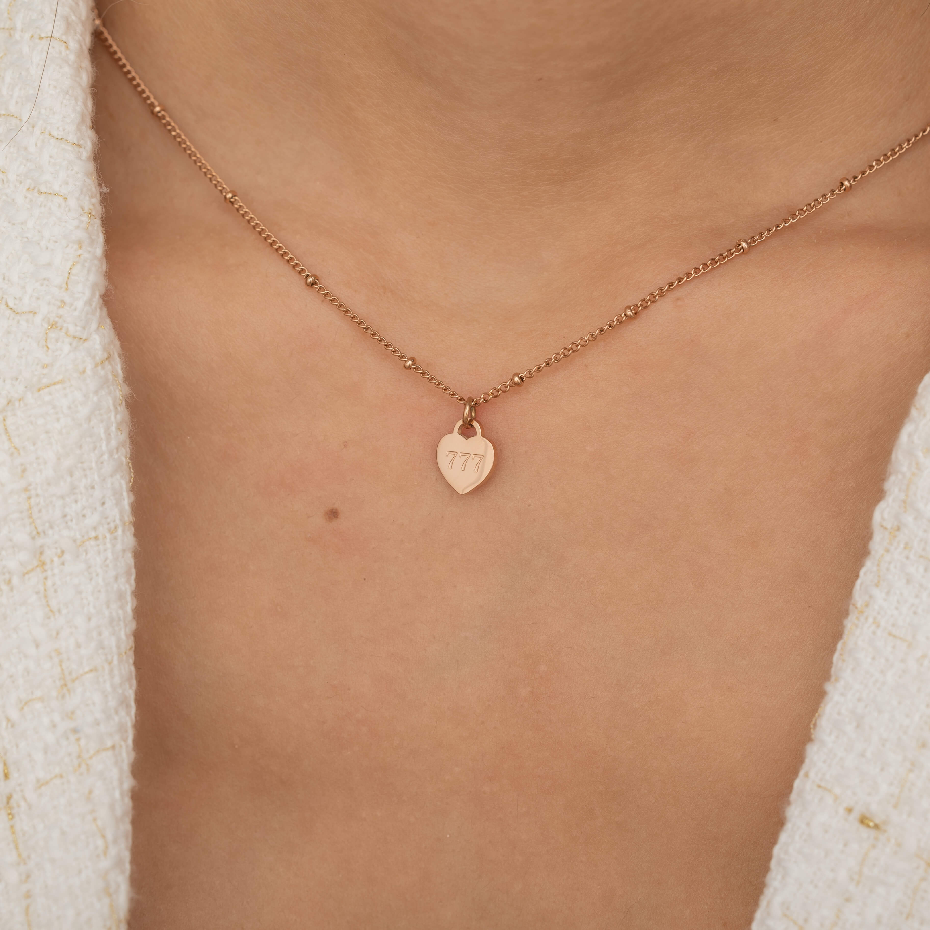 Rose Gold 777 Angel number necklace in heart shape