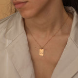 custom hand sign symbol necklaces in gold, silver, and rose gold with engraved rectangular pendants featuring various hand sign designs.