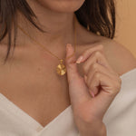 Circle sunburst necklace with an etched sunburst design on a round pendant, symbolizing warmth and vitality, perfect for adding a touch of boho elegance.