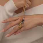 Gold and Silver magician tarot necklace with cubic zirconia accents and an onyx back stone, symbolizing the balance of elemental force.