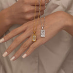 Silver and Gold the wheel tarot necklace with cubic zirconia accents and a mother of pearl back stone, symbolizing change, destiny, and the cycles of life. 