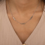silver necklace with multiple engraved name bar charms, personalized family name jewelry