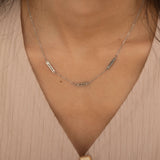 silver necklace with multiple engraved name bar charms, personalized family name jewelry