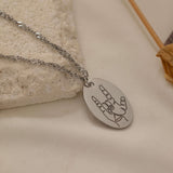 close up of a rocker hand gesture silver necklace.