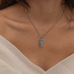  silver empress tarot necklace with cubic zirconia accents and an turquoise back stone, symbolizing abundance, beauty, and feminine power. 