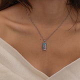  silver empress tarot necklace with cubic zirconia accents and an turquoise back stone, symbolizing abundance, beauty, and feminine power. 