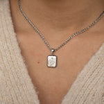 Silver Birth Flower Pendant with a Figaro Chain Necklace