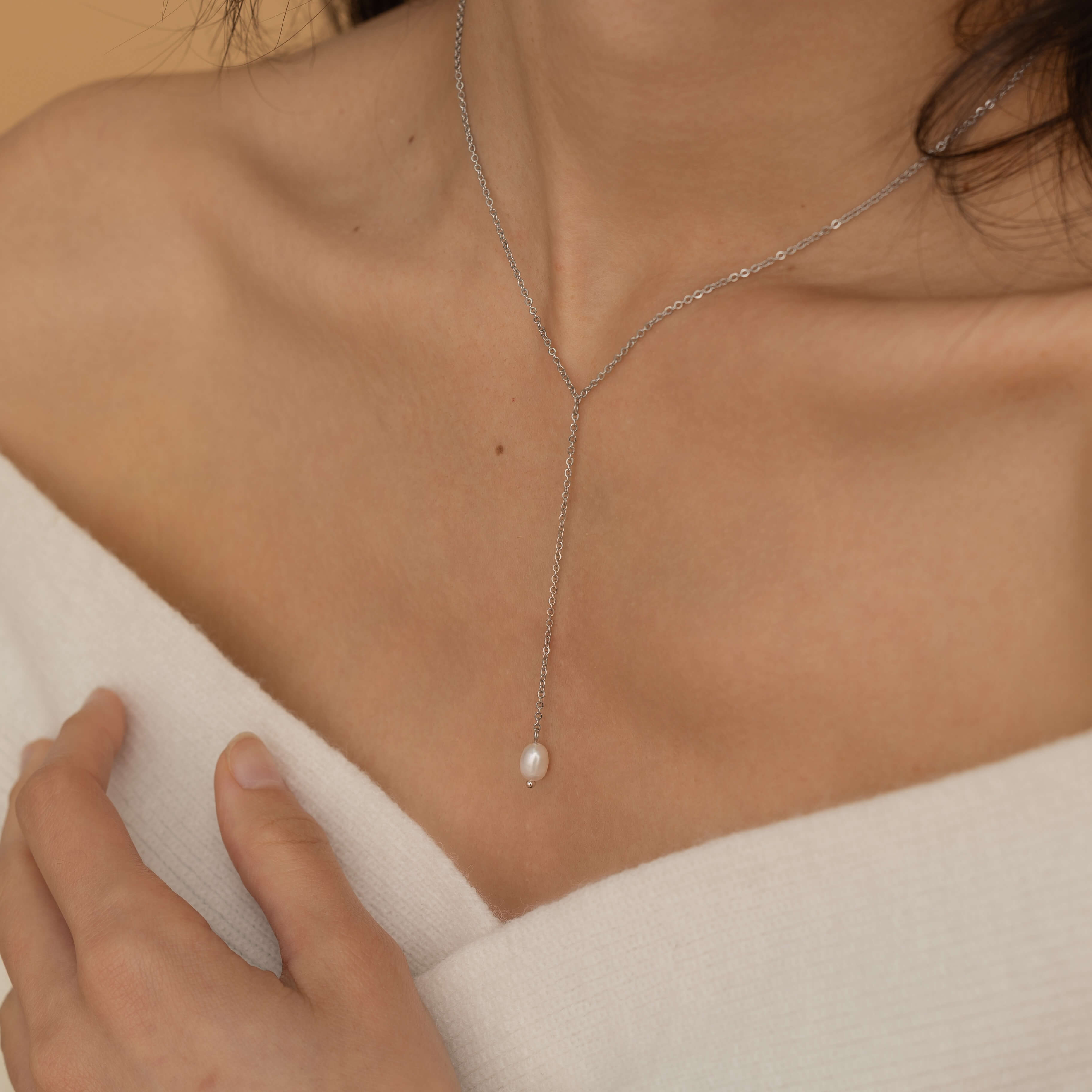 Silver lariat necklace with a freshwater pearl drop, shaped in a y necklace with  minimalist and elegant look.