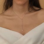 Silver lariat necklace with a freshwater pearl drop, shaped in a y necklace with  minimalist and elegant look.