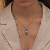 Silver the sun tarot necklace with cubic zirconia accents and an turquoise  back stone, symbolizing happiness, vitality, and success. 