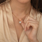 Square mother of pearl pendant with a gold frame on a gold chain