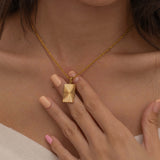 rectangle sunburst necklace with an etched sunburst design on a rectangle pendant, symbolizing warmth and vitality, perfect for adding a touch of boho elegance.
