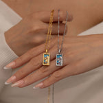Gold and silver empress tarot necklace with cubic zirconia accents and an turquoise back stone, symbolizing abundance, beauty, and feminine power. 