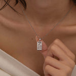 Silver The Moon tarot necklace with cubic zirconia accents and an mother of pearls back stone, symbolizing intuition, mystery and subconscious. 