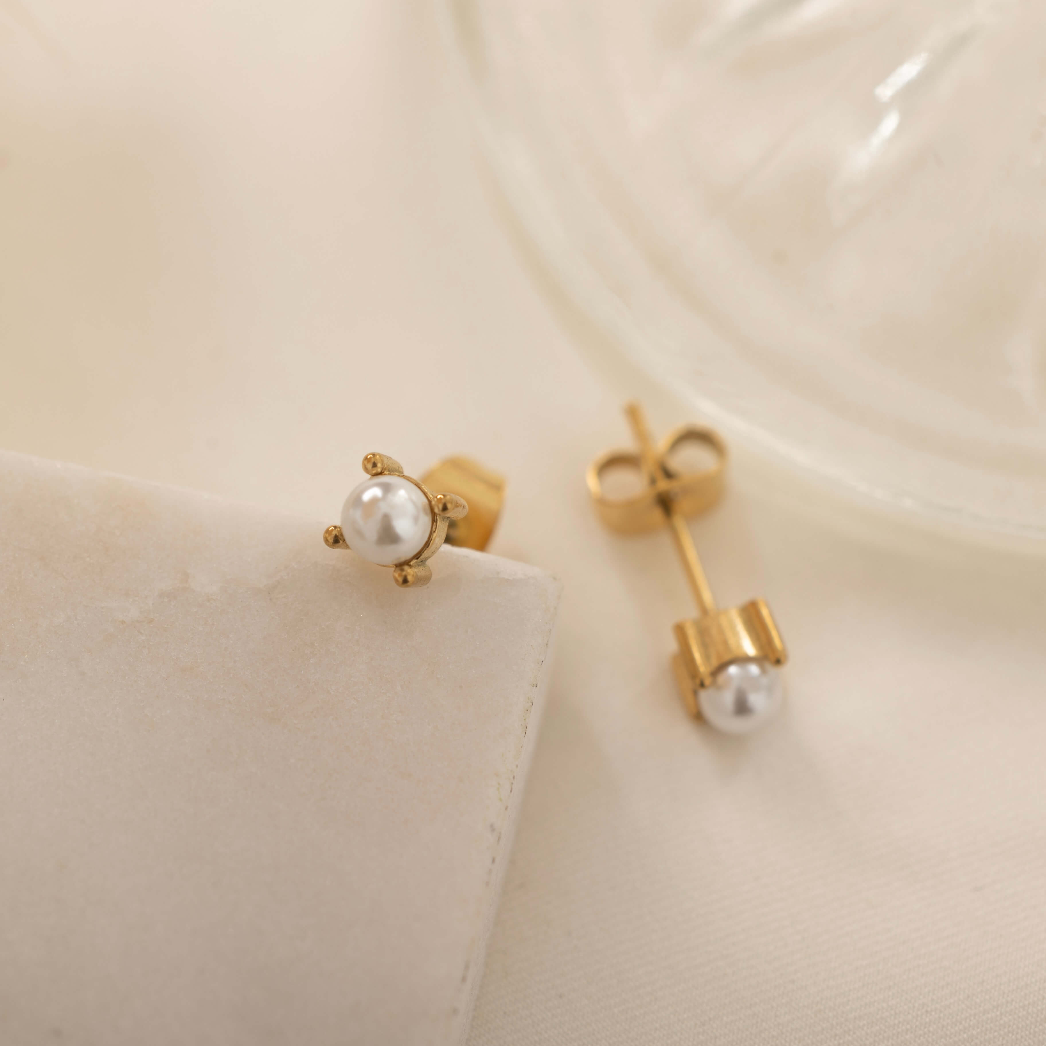 dainty gold pearl stud earrings for everyday wear since they are waterproof and made of tarnish free material